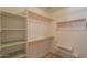 Bright walk-in closet offering shelving and ample storage solutions for an organized wardrobe at 3665 E Thames Way, San Tan Valley, AZ 85140