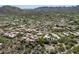 Aerial view showcasing homes nestled in lush desert landscape with community pool and mature desert vegetation at 38065 N Cave Creek Rd # 52, Cave Creek, AZ 85331