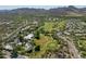 Picturesque aerial view of community golf course surrounded by lush landscaping and mountain scenery at 38065 N Cave Creek Rd # 52, Cave Creek, AZ 85331