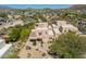 Beautiful aerial view of the house, desert landscape, and mountain views at 38065 N Cave Creek Rd # 52, Cave Creek, AZ 85331