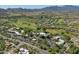 Discover an aerial view showcasing community golf course, community pool, and lush desert surroundings at 38065 N Cave Creek Rd # 52, Cave Creek, AZ 85331