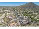 Explore an aerial view of city streets, commercial buildings, with the backdrop of scenic desert hills at 38065 N Cave Creek Rd # 52, Cave Creek, AZ 85331