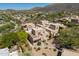 Stunning aerial view of a property surrounded by lush greenery and mountain vistas at 38065 N Cave Creek Rd # 52, Cave Creek, AZ 85331