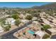 Discover a community with inviting pool, distinctive architecture, & scenic views from this aerial perspective at 38065 N Cave Creek Rd # 52, Cave Creek, AZ 85331