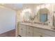 Bathroom showcasing dual sinks with granite countertops and white cabinetry at 38065 N Cave Creek Rd # 52, Cave Creek, AZ 85331