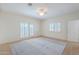 Inviting bedroom with tile flooring, plantation shutters, and a ceiling fan at 38065 N Cave Creek Rd # 52, Cave Creek, AZ 85331