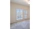 Bedroom featuring a ceiling fan, shuttered windows, and neutral carpet flooring at 38065 N Cave Creek Rd # 52, Cave Creek, AZ 85331