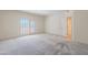 Bright bedroom with plush carpeting and access to a private balcony with scenic views at 38065 N Cave Creek Rd # 52, Cave Creek, AZ 85331