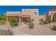 Exterior of a Southwestern-style house with desert landscaping at 38065 N Cave Creek Rd # 52, Cave Creek, AZ 85331