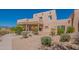 Charming two-story home with desert landscaping and inviting front walkway. Located in a sunny, desirable area at 38065 N Cave Creek Rd # 52, Cave Creek, AZ 85331
