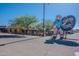 Charming Frontier Town sign with cowboy statue, capturing the spirit of the Old West at 38065 N Cave Creek Rd # 52, Cave Creek, AZ 85331