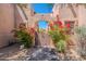 Charming gated entrance with flowering bougainvillea, leading to a private courtyard at 38065 N Cave Creek Rd # 52, Cave Creek, AZ 85331