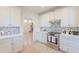 Bright kitchen featuring white cabinetry, stainless steel appliances, and stylish backsplash at 38065 N Cave Creek Rd # 52, Cave Creek, AZ 85331