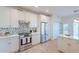 Well-equipped kitchen showcasing white cabinetry, stainless steel appliances, and a stylish backsplash for a modern cooking experience at 38065 N Cave Creek Rd # 52, Cave Creek, AZ 85331