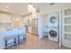 Open concept kitchen with stainless steel appliances, bar seating, and adjacent laundry area at 38065 N Cave Creek Rd # 52, Cave Creek, AZ 85331