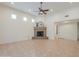 Spacious living room with a fireplace and large windows providing plenty of natural light at 38065 N Cave Creek Rd # 52, Cave Creek, AZ 85331
