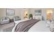 Cozy main bedroom features neutral colors, soft chairs, stylish decorations, and an ensuite bathroom for added privacy at 38065 N Cave Creek Rd # 52, Cave Creek, AZ 85331
