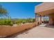 Spacious covered patio with an outdoor cooking area and scenic desert views at 38065 N Cave Creek Rd # 52, Cave Creek, AZ 85331