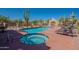 Backyard oasis featuring a pool and jacuzzi and desert landscaping at 38065 N Cave Creek Rd # 52, Cave Creek, AZ 85331