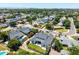 Expansive aerial view of a home with a lush yard, mature trees and a city skyline in the distance at 3813 N 37Th St, Phoenix, AZ 85018