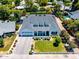 Stunning aerial view of a modern farmhouse with a well-manicured lawn and mature landscaping at 3813 N 37Th St, Phoenix, AZ 85018