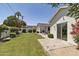 Spacious backyard with a patio, well-maintained lawn, and tasteful landscaping at 3813 N 37Th St, Phoenix, AZ 85018