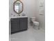 Bathroom with gray vanity, marble countertop, white toilet and decorative wall art at 3813 N 37Th St, Phoenix, AZ 85018