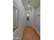 Hallway with hardwood floors, a decorative mirror and a storage nook with bench seating at 3813 N 37Th St, Phoenix, AZ 85018