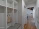 Hallway featuring hardwood floors, a coat rack, a storage nook with bench seating at 3813 N 37Th St, Phoenix, AZ 85018