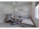 Comfortable living room with a gray couch, chair, round coffee table and natural light at 3813 N 37Th St, Phoenix, AZ 85018