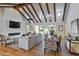 Bright living room featuring vaulted ceilings with wood beams, fireplace, and hardwood floors at 3813 N 37Th St, Phoenix, AZ 85018