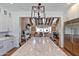 View of the kitchen and living spaces with an oversized island featuring marble countertop and hardwood floors at 3813 N 37Th St, Phoenix, AZ 85018