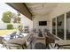Covered outdoor patio featuring comfortable seating, a fire pit, and outdoor grill at 3813 N 37Th St, Phoenix, AZ 85018