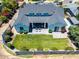 Aerial view of home featuring a well-manicured lawn, flowers, patio area with seating and an enclosed yard at 3813 N 37Th St, Phoenix, AZ 85018