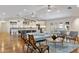 Open-concept living room with hardwood floors, modern furnishings, and a seamless flow to the kitchen at 3817 E Highland Ave, Phoenix, AZ 85018