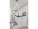 Large walk-in closet with custom shelving, drawers, and a center island for storage and organization at 3817 E Highland Ave, Phoenix, AZ 85018