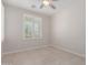 Carpetless bedroom featuring ceiling fan and shuttered windows at 3892 E Harrison St, Gilbert, AZ 85295