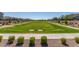 Common area with a large grassy area and walking paths at 3892 E Harrison St, Gilbert, AZ 85295