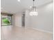 Spacious dining area featuring tile flooring, neutral paint, recessed lighting, and sliding glass door access to the backyard at 3892 E Harrison St, Gilbert, AZ 85295