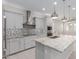 Modern kitchen featuring granite countertops, stainless steel appliances, and a stylish backsplash at 3892 E Harrison St, Gilbert, AZ 85295