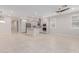 Spacious open-concept kitchen featuring stainless appliances, gray cabinets, and granite countertops at 3892 E Harrison St, Gilbert, AZ 85295