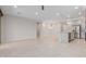 Spacious open-concept living space with tile flooring, recessed lighting, neutral paint, and an island with a sink at 3892 E Harrison St, Gilbert, AZ 85295