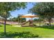 Community playground under sun shades with slides and climbing structures at 3892 E Harrison St, Gilbert, AZ 85295