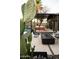Outdoor lounge area with stylish furniture, a modern fire pit, and desert landscaping near the pool at 4032 N 45Th Pl, Phoenix, AZ 85018