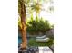 Lush backyard retreat featuring a pool, rock landscaping, and comfortable lounge seating at 4032 N 45Th Pl, Phoenix, AZ 85018