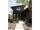 Modern home exterior with a cozy outdoor seating area and desert landscaping at 4032 N 45Th Pl, Phoenix, AZ 85018