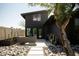Private outdoor patio with stylish seating, desert landscaping, and the home's contemporary architecture at 4032 N 45Th Pl, Phoenix, AZ 85018