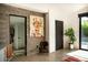 Stylish foyer with concrete floors, modern art, and bright natural light pouring in through the windows at 4032 N 45Th Pl, Phoenix, AZ 85018