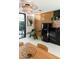 Chic kitchen nook with modern appliances, sleek cabinetry, and stylish wood slat wall accents at 4032 N 45Th Pl, Phoenix, AZ 85018