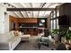 Open-concept living space with modern decor, exposed beams, and a stylish kitchen, perfect for entertaining at 4032 N 45Th Pl, Phoenix, AZ 85018